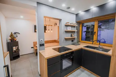 a kitchen with a sink and a counter top at Panorama Krvavec Ski-in, Ski-out in Cerklje na Gorenjskem