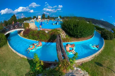 an aerial view of a water park with people on water slides at La Hiška Čatež with Tickets - each guest gets 2 entries per day in Čatež ob Savi