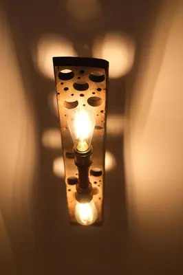 a light hanging on a wall in a room at Hiška Brajda in Rogaška Slatina