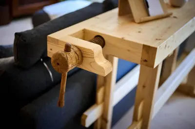 a wooden table with a key on top of it at Pri Štefacovih - Authentic house in Grahovo