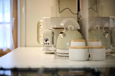 a counter top with a coffee maker and a toaster at Pri Štefacovih - Authentic house in Grahovo
