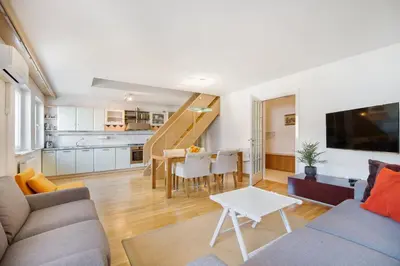 a living room with a couch and a table at City Central Ljubljana in Ljubljana