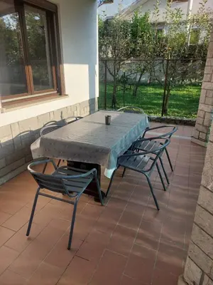 a concrete table and chairs on a patio at Apartma MILA in Šempas