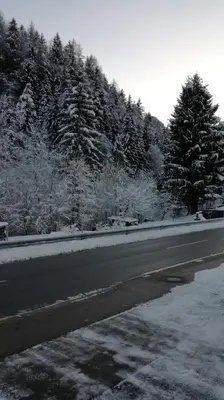 a road with snow on the side of the road at Apartment Stefka in Kranjska Gora