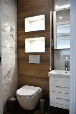 a bathroom with a white toilet and a sink at CASA BOX PREMIUM free garage in Maribor