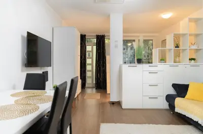 a living room with a couch and a table at Central Castle Apartments in Ljubljana