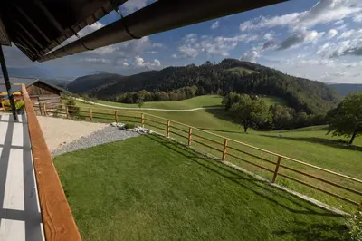 a view of a golf course from the porch of a house at Hiška ViSa in Šoštanj