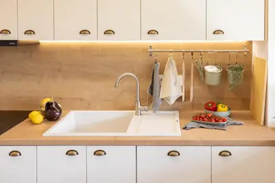 a kitchen with a sink and some fruits and vegetables at Hiška ViSa in Šoštanj