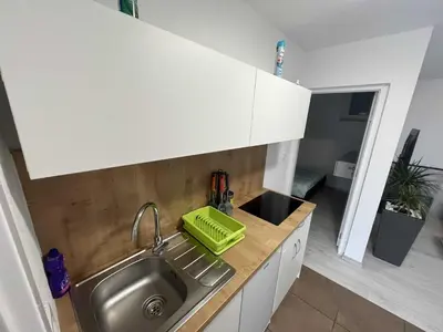 a kitchen with a sink and a counter top at Apartment Romeo & Julija, Near terme Olimia, Free Parking in Podčetrtek