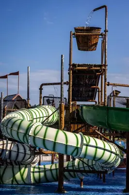 a row of water slides in the water at Apartment Romeo & Julija, Near terme Olimia, Free Parking in Podčetrtek