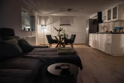 a living room with a couch and a table at Green Street Hideaway in Šempeter v Savinjski Dolini