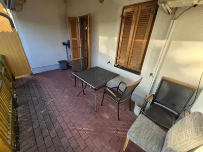 a table and chairs in the corner of a room at Marjetjca 40 in Moravske Toplice
