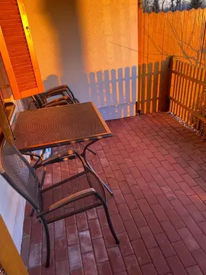 two chairs and a table on a patio at Marjetjca 40 in Moravske Toplice