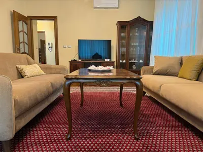 a living room with two couches and a coffee table at Vila Majda Elegant Apartments with Prime Location and Parking in Ljubljana