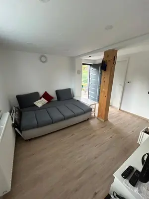 a living room with a couch in the middle of it at Holiday house Gradišče in Škofljica