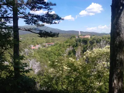 a view of the mountains from the forest at Osterija Na Planinci in Divača