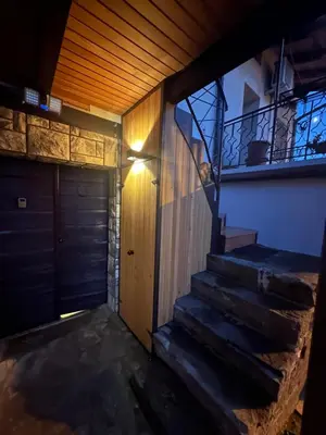an entrance to a house with a door and stairs at PERLE d ARCONI in Renče