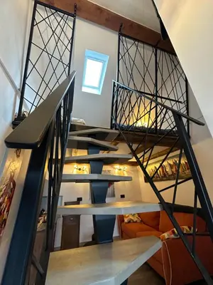 a set of stairs in a room with a stair case at PERLE d ARCONI in Renče