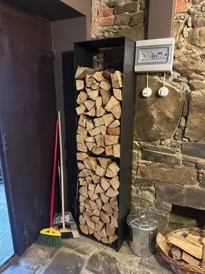 a stack of fire wood next to a wall at PERLE d ARCONI in Renče