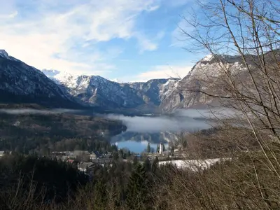 a view of a town and a lake in the mountains at Apartment Šporar in Bohinj