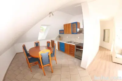 a kitchen with a table and chairs in a room at Panoramic View in Postojna