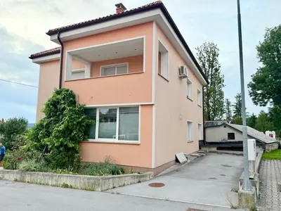 a pink house with a driveway in front of it at Panoramic View in Postojna