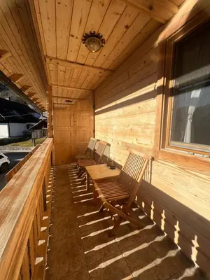 a row of chairs sitting in the back of a sauna at Apartmaji Katrnjek in Bohinj