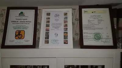 three framed signs sitting on a fireplace mantle at HERBALIJA Apartment Herbalija - sorrounded by Nature in Podčetrtek