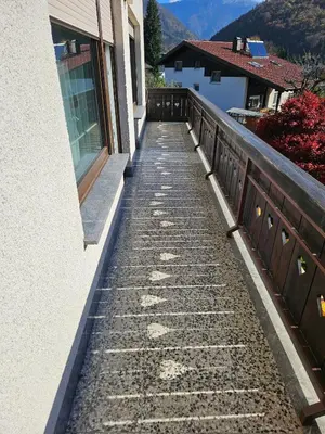 a stone walkway next to a building next to a building at Apartment Josipina in Preddvor