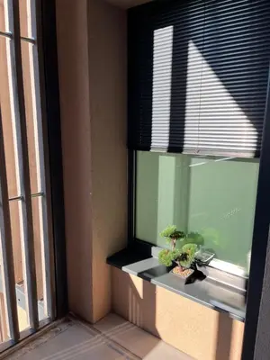 a window with two potted plants on a window sill at TB7 Bled in Bled