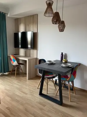 a dining room with a black table and chairs at TB7 Bled in Bled