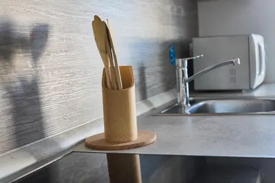 a knife block sitting on a counter next to a sink at Apartma Bled in Bled