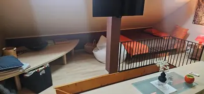 a room with a room with a bed and a table at Apartment ZOI in Ptuj