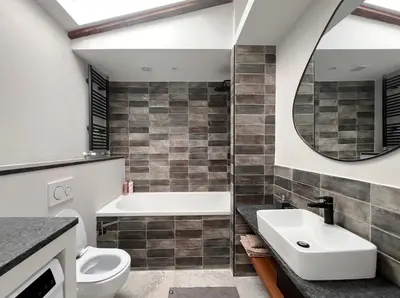 a bathroom with a sink and a toilet and a mirror at Tranquil Escape in Vipava