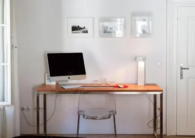 a desk with a computer on top of it at FishSquare in Ljubljana