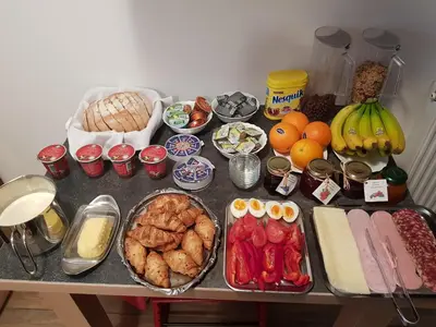 a table with many different types of food on it at Tourist farm Megušar in Škofja Loka