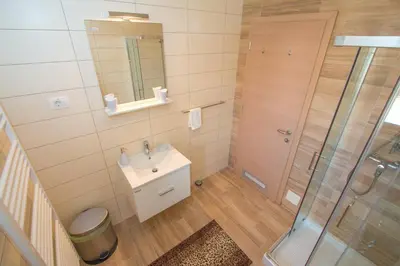 a bathroom with a sink and a shower at Tourist farm Megušar in Škofja Loka