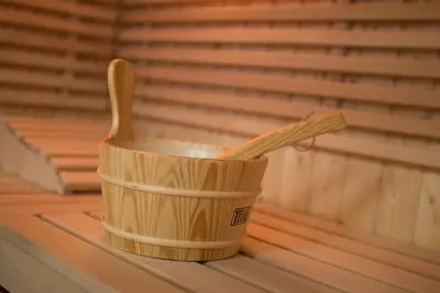 a wooden cup with a wooden spoon on a shelf at Tourist farm Megušar in Škofja Loka