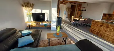 a living room with a couch and a table at Hiša Galeria in Loče pri Poljčanah