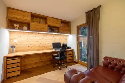 an office with a desk with a computer and a chair at Chalet Jasna in Kranjska Gora
