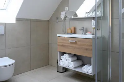 a bathroom with a sink and a toilet at Hiša Janko in Dolenjske Toplice