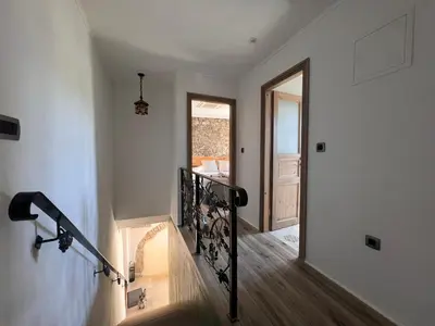 a staircase in a home with a stair railing at Historic Wine-Stone House in Vipava