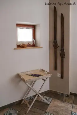 a table in the corner of a room with a window at Apartment Villa Carolina in Kranjska Gora