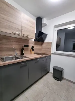 a kitchen with a sink and a large window at Apartma Termal Čatež - nastanitev z vključenimi 6-imi kopalnimi kartami - 6 tickets included in Čatež ob Savi