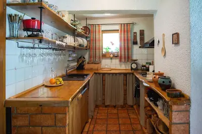a kitchen with wooden counters and a counter top at Chalet Zala in Kranjska Gora