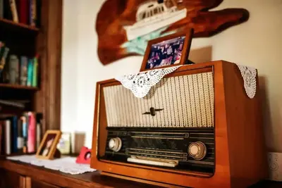 an old fashioned radio sitting on a table at Opulent Villa with Sauna in the Heart of Karst in Dutovlje