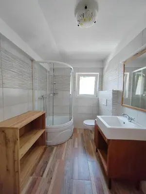 a bathroom with a tub and a toilet and a sink at Apartma SOFIA in Tolmin