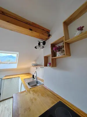 a kitchen with a sink and a counter top at Apartma SOFIA in Tolmin