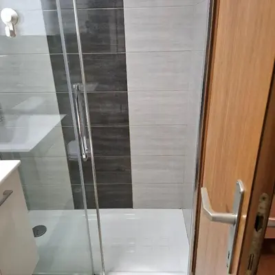 a shower with a glass door in a bathroom at Bohinj Planika J2 in Bohinj