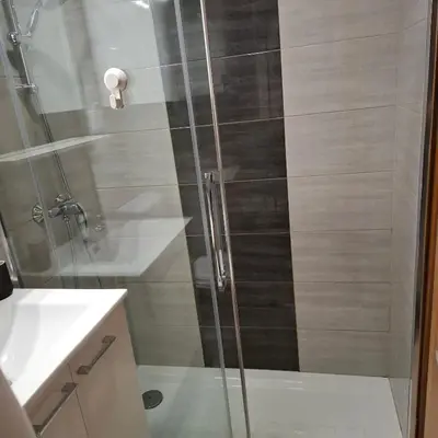 a shower with a glass door in a bathroom at Bohinj Planika J2 in Bohinj